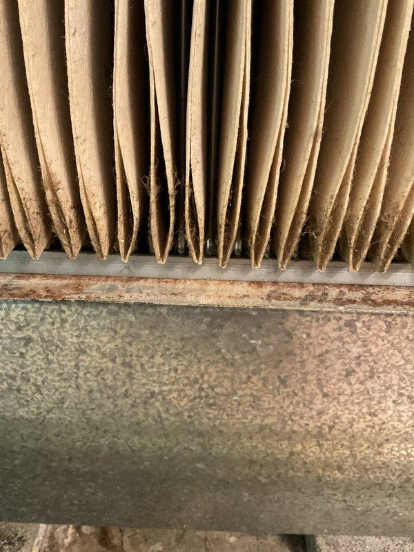 Completed routine MVP heating maintenance visit on residential HVAC system. Inspected air handler unit, evaporative cooling media, and ductwork components. Documented existing filter condition showing dust accumulation and noted minor surface oxidation on connected ductwork requiring monitoring during future service intervals.