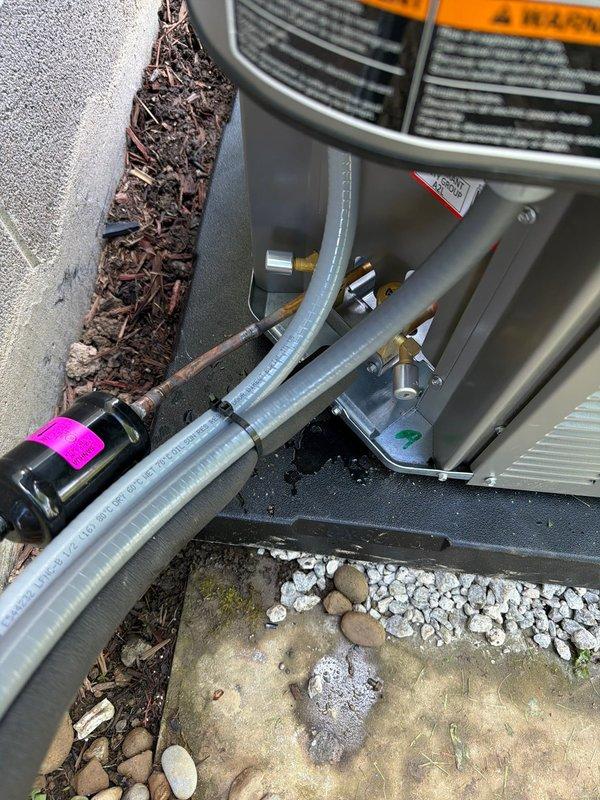 Completed installation of 80% AFUE gas furnace and air conditioning system. Positioned outdoor condenser unit on concrete pad with proper clearances, connected refrigerant lines with insulated copper tubing, installed new contactor with appropriate electrical connections, and secured all piping and conduit. System tested and verified operational with all components functioning within manufacturer specifications.