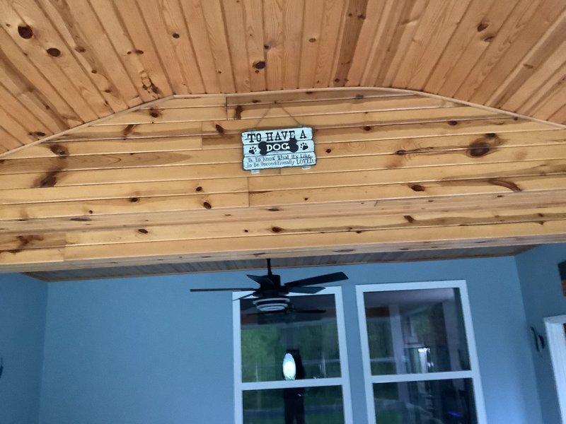 Completed installation of a 1-to-1 mini-split heat pump system with condensate pump. Mounted indoor air handler unit on interior wall of covered porch area and positioned outdoor condensing unit on concrete pad against exterior wall with proper clearances. Ran refrigerant line set, electrical conduit, and condensate drain line between indoor and outdoor units, ensuring secure connections and proper insulation throughout.