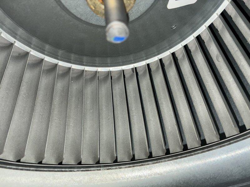 Completed scheduled BS-MVP cooling maintenance visit on 3-year-old system after confirming appointment availability. Performed comprehensive inspection of blower assembly, finding wheel and internal components clean and properly maintained with no debris accumulation. Inspected outdoor condenser unit and documented significant contamination of coil fins with leaves, dirt, and organic debris requiring attention. Captured photographic documentation of both indoor blower condition and outdoor unit status for service records.