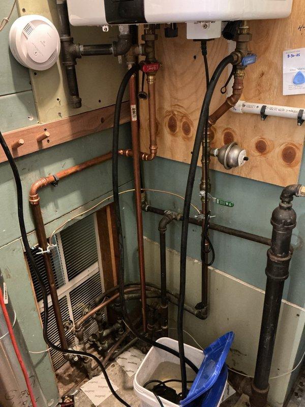 Performed annual descaling maintenance on a two-year-old tankless water heater system. Flushed unit with descaling solution to remove mineral buildup and maintain optimal heat exchanger efficiency, ensuring continued reliable hot water delivery and extending equipment lifespan.