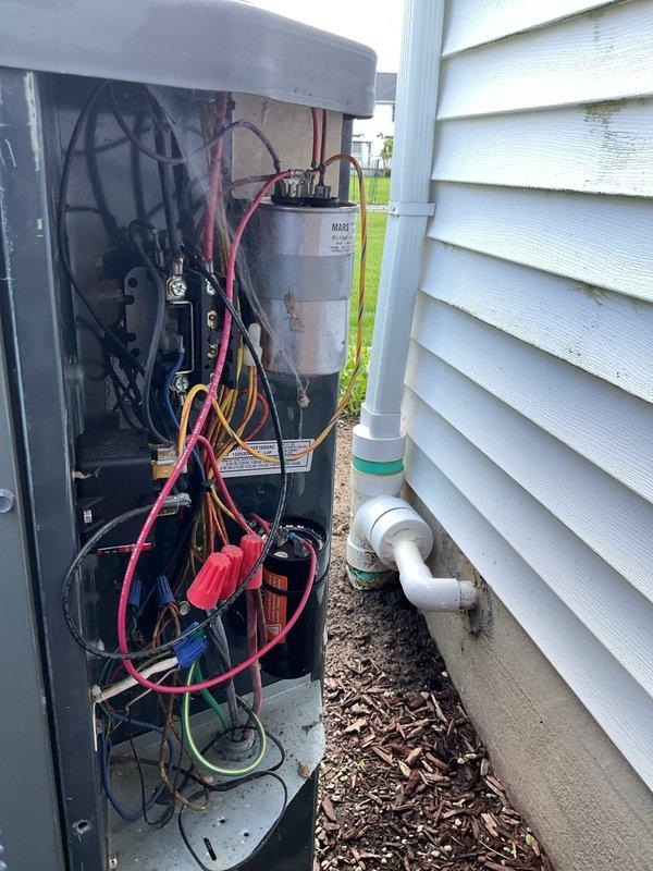 Completed routine cooling maintenance visit on 12-year-old Lennox HVAC system. Performed comprehensive inspection of indoor air handler unit and outdoor condensing unit, verified proper operation of all components including electrical connections, capacitor, and refrigerant lines. Observed significant corrosion on outdoor condensate reservoir requiring monitoring, confirmed all PVC drain lines flowing properly and system operating within normal parameters.