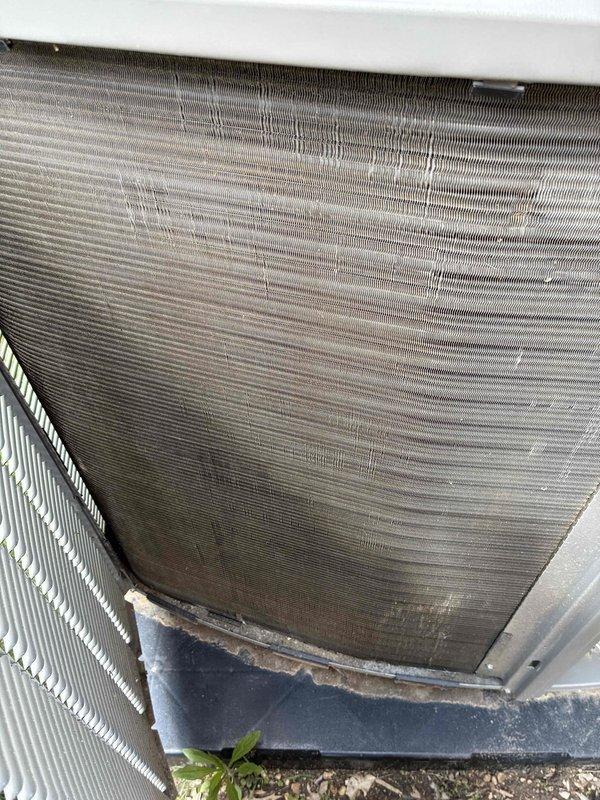 Performed routine maintenance on 2-year-old Lennox air conditioning system. Inspected outdoor condenser unit, noting moderate accumulation of dirt and debris on aluminum fins with some minor fin compression. Evaluated ductwork system for potential cleaning needs and verified proper operation of all components.