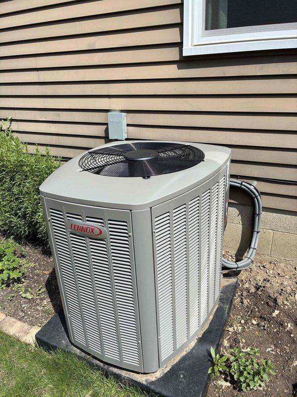Performed routine maintenance on 2-year-old Lennox air conditioning system. Inspected outdoor condenser unit, noting moderate accumulation of dirt and debris on aluminum fins with some minor fin compression. Evaluated ductwork system for potential cleaning needs and verified proper operation of all components.