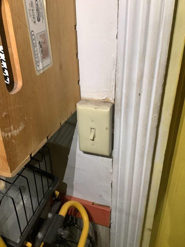 Installed new light fixture and single-pole switch in older residential property with existing wiring infrastructure. Replaced outdated switch plate with new brown cover plate, ensuring proper electrical connections and code-compliant installation throughout the aged home's electrical system.