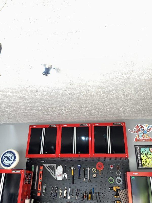 Installed one new electrical outlet and two LED light fixtures in garage workspace. All installations completed to code with proper circuit protection and secure mounting to ceiling and wall surfaces.