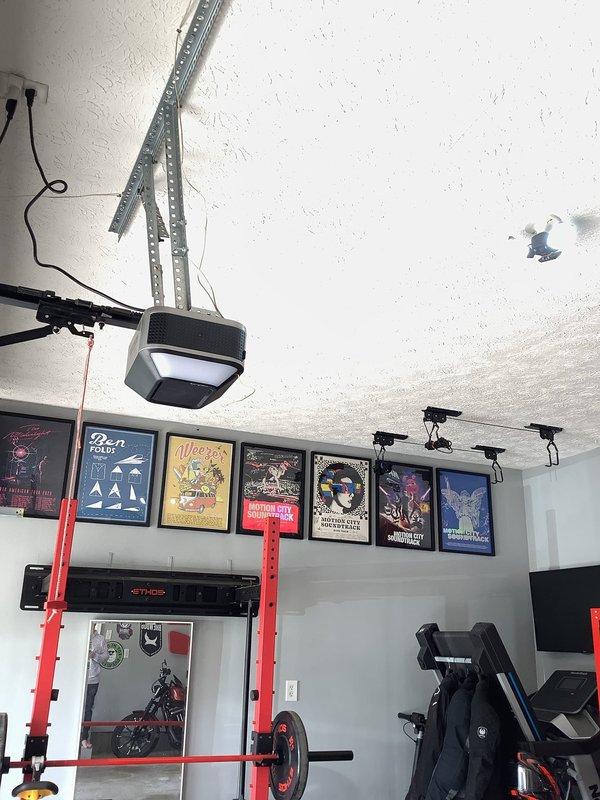 Installed one new electrical outlet and two LED light fixtures in garage workspace. All installations completed to code with proper circuit protection and secure mounting to ceiling and wall surfaces.