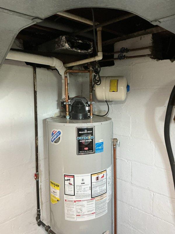 Performed routine maintenance flush and fill service on a Bradford White Defender Safety System tanked water heater. Successfully drained sediment buildup from the tank, flushed the system to remove accumulated mineral deposits, and refilled the unit to restore optimal performance and extend equipment lifespan.