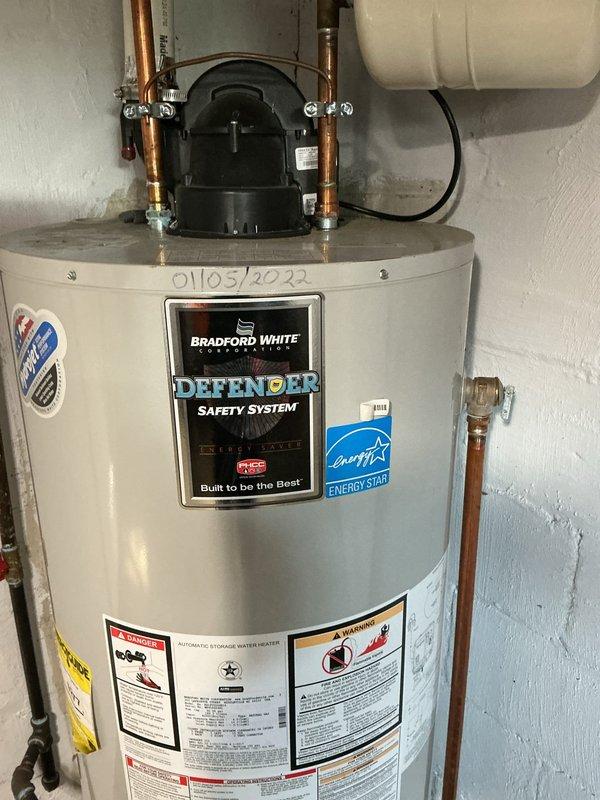 Performed routine maintenance flush and fill service on a Bradford White Defender Safety System tanked water heater. Successfully drained sediment buildup from the tank, flushed the system to remove accumulated mineral deposits, and refilled the unit to restore optimal performance and extend equipment lifespan.