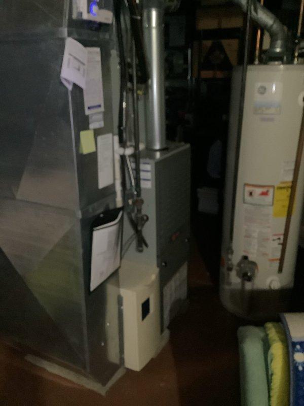 Completed routine cooling maintenance on 21-year-old residential air conditioning system. Performed comprehensive inspection of outdoor condensing unit and indoor furnace components, verified system operation, documented equipment condition with photographs for maintenance records.