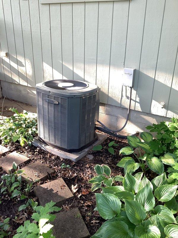 Completed routine cooling maintenance on 21-year-old residential air conditioning system. Performed comprehensive inspection of outdoor condensing unit and indoor furnace components, verified system operation, documented equipment condition with photographs for maintenance records.
