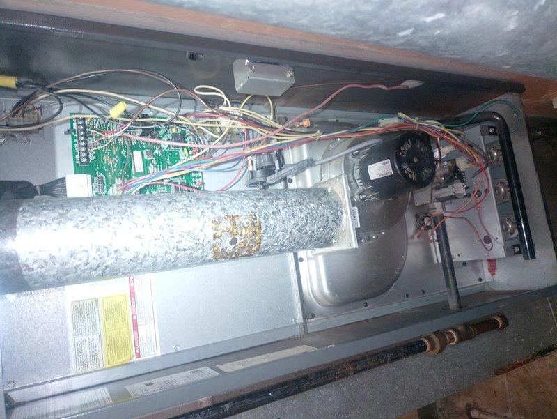 Completed scheduled air conditioning tune-up and system inspection. Upon accessing the indoor air handler unit in the attic, discovered significant ice buildup on the refrigerant suction line, indicating a cooling system malfunction likely caused by restricted airflow or low refrigerant charge. Performed comprehensive diagnostics including filter inspection, airflow verification, and refrigerant pressure testing. Inspected outdoor condensing unit, confirmed proper operation of condenser fan and compressor, and cleared debris from surrounding area. Addressed the frozen evaporator coil issue, allowed system to thaw, and verified proper system operation before departure. Provided complimentary carbon monoxide detector as part of promotional service package.