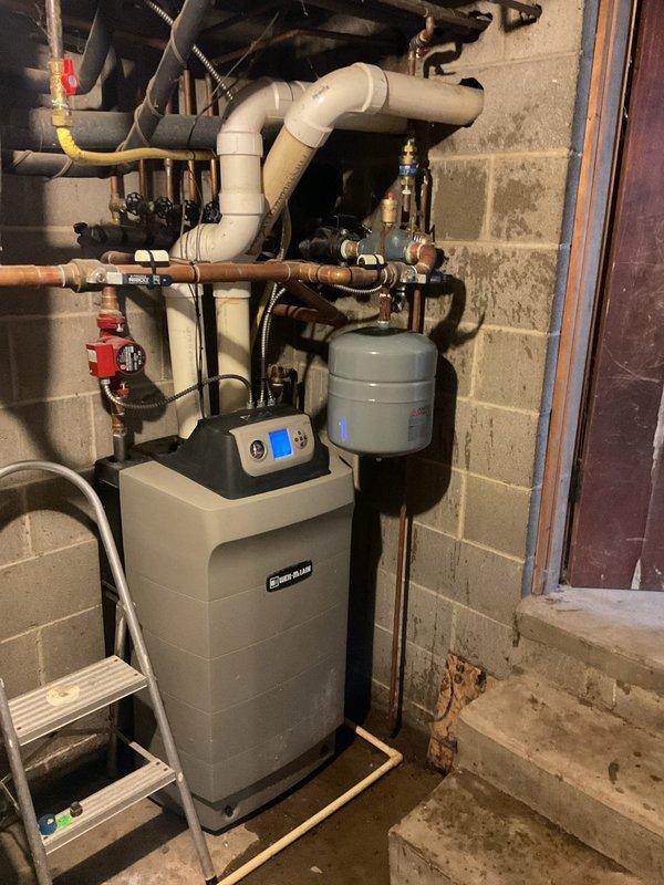 Replaced failed Extrol expansion tank Model #30 and defective automatic air vent on hydronic heating system. Removed old expansion tank from piping assembly, installed new Extrol #30 tank with proper mounting and connections, and replaced malfunctioning air vent to restore proper system pressurization and eliminate air binding issues. System tested and verified operational with proper pressure readings and no leaks detected at new connections.