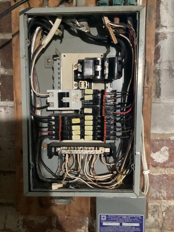 Completed comprehensive whole-home electrical inspection for older residential property to assess current electrical system condition and determine scope of potential rewiring or updating needs. Thoroughly evaluated main electrical panel, circuit breaker configuration, wiring conditions, grounding system, and overall electrical infrastructure throughout the home. Documented findings with detailed photographs of electrical panel showing mixed breaker types, neutral/ground bar connections, and service entrance equipment, as well as basement utility area conditions. Identified areas requiring attention for code compliance and safety improvements to provide homeowner with complete assessment for future electrical system modernization.