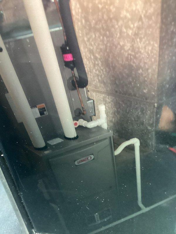 Completed comprehensive AC tune-up on 2-year-old Lennox system located in mechanical space. Performed standard maintenance protocol including inspection of refrigerant lines with safety switch, verification of condensate drain operation, system performance testing, and visual inspection of all components. Unit operating within normal parameters with no issues identified.