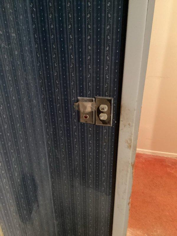 Completed free electrical estimate for bathroom rewiring project. Assessed existing electrical fixtures including outlet and switch mounted on textured wall panel, evaluating conditions and determining scope of work needed to coordinate with plumbing installation scheduled for early May. Documented current electrical configuration and accessibility features including multiple grab bar installations to ensure proper electrical planning for renovated bathroom space.