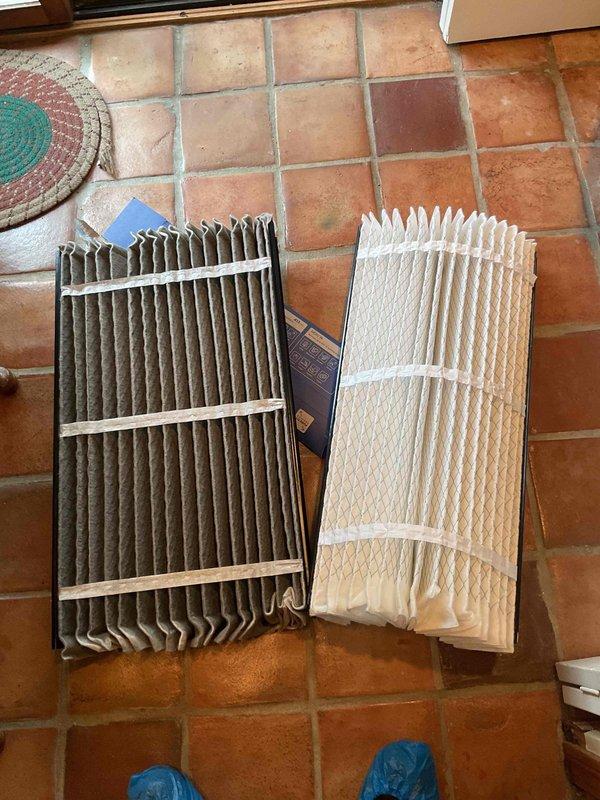 Completed MVP cooling maintenance visit on 12-year-old system. Replaced dirty air filter with new unit, as evidenced by significant dust accumulation on the old filter. Inspected condensate drain system and found standing water with debris and sediment accumulation in drain pan, indicating potential drainage issue that will require monitoring or future attention to prevent overflow and water damage.