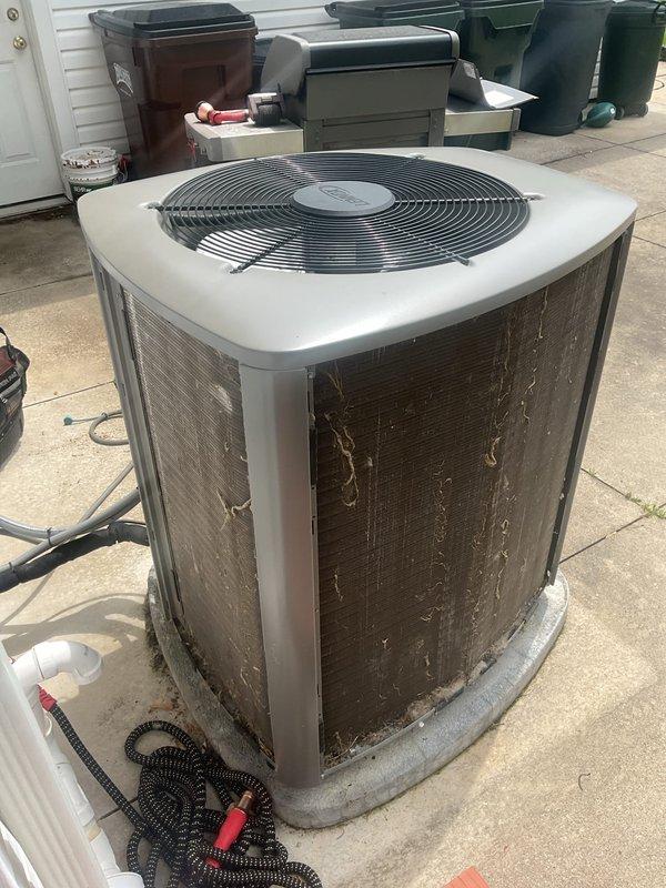 Completed scheduled maintenance visit on a 5-year-old residential air conditioning system. Performed comprehensive inspection of outdoor condenser unit, noting weathered exterior mesh screening with discoloration and dirt accumulation. Inspected indoor air handler and verified pleated air filter condition, which appeared clean and functional with no excessive dirt buildup requiring immediate replacement. Unit operating within normal parameters at time of service.