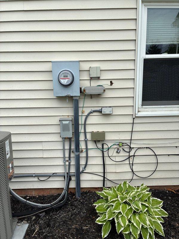 Completed installation of 480-volt AC circuit and power wiring infrastructure for residential electrical service. Work included panel configuration with proper circuit breaker arrangement, exterior meter base installation with associated conduit runs and junction boxes, and full service connection to ensure code-compliant power distribution throughout the structure.