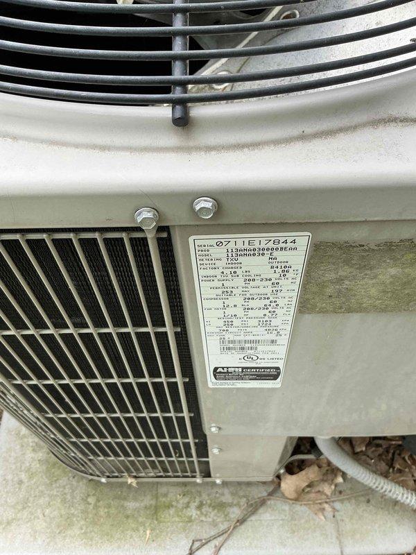 Provided comprehensive replacement estimates for aging HVAC system including outdoor air conditioning condenser unit and Whirlpool water heater, both exceeding 15 years of service life. Documented existing equipment conditions through detailed photography showing weathered AC unit with algae growth on concrete pad and residential water heater installation in basement utility area. Generated multiple quote options for complete system replacement of furnace, air conditioning unit, and hot water heater.