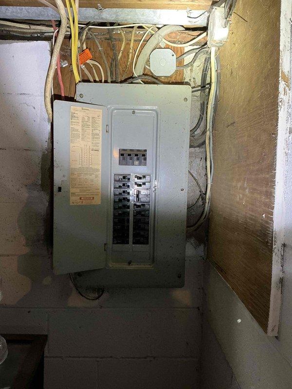 Conducted site assessment for mini split installation in second-floor dormer bedroom measuring 14x14 feet. Evaluated mounting location for interior unit on exterior wall with corresponding exterior unit placement directly below, verified electrical service panel accessibility in basement on same wall for dedicated circuit installation, and documented existing conditions through photography. Confirmed installation requirements and coordinated scheduling to accommodate customer availability constraints.