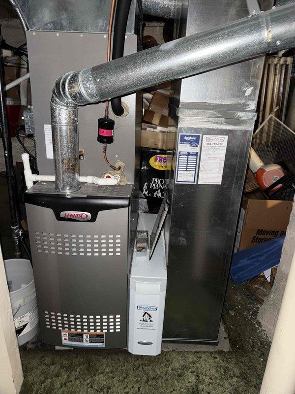 Completed preventive maintenance cooling visit on 6-year-old Lennox HVAC system. Performed standard A/C maintenance procedures including inspection of control board DIP switch settings, verified proper system operation, and documented equipment condition through photographic records. All components found in good working order with no visible damage or corrosion detected on control circuitry.