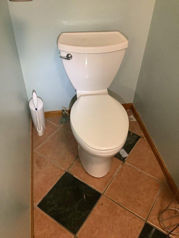 Responded to service call for malfunctioning garbage disposal and loose second-floor toilet. Assessed garbage disposal unit and confirmed motor failure due to burnout. Evaluated second-floor toilet instability caused by broken mounting bolts at the base, which occurred during previous tightening attempt. Documented existing conditions including deteriorated toilet bowl condition and missing floor tiles around toilet base requiring future attention.