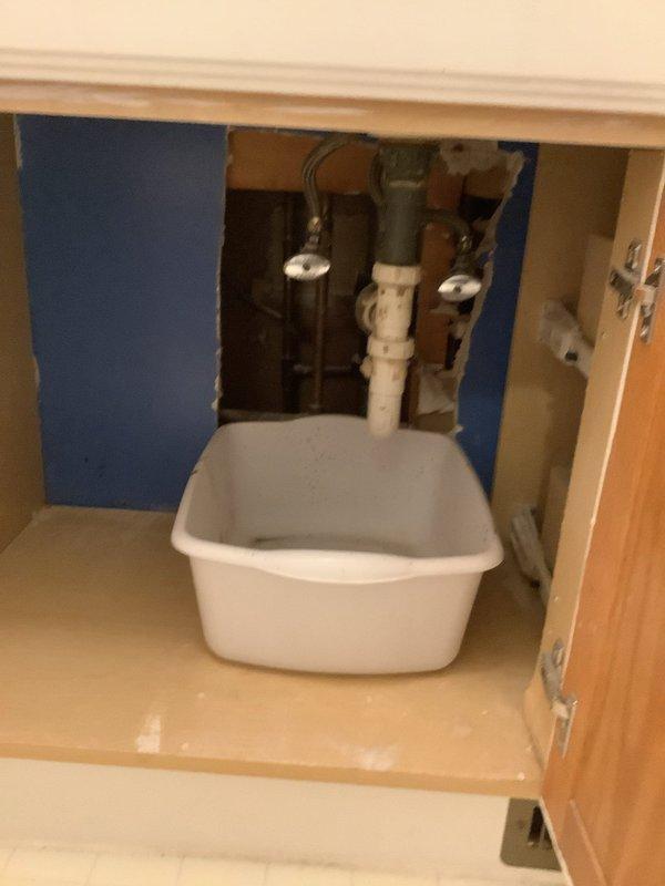 Completed full cast iron drain stack replacement in split-level residence servicing two bathrooms from basement through second floor. Cut and opened walls to gain access to deteriorated cast iron piping. Removed all existing cast iron waste lines and rebuilt complete drainage system using PVC materials. Installed new waste and overflow assemblies for both bathrooms, including new P-traps for two toilets and lavatory fixtures. Ran new PVC stack from second floor to basement with new cleanout installation at base. All drain connections tested and verified for proper flow and seal integrity.