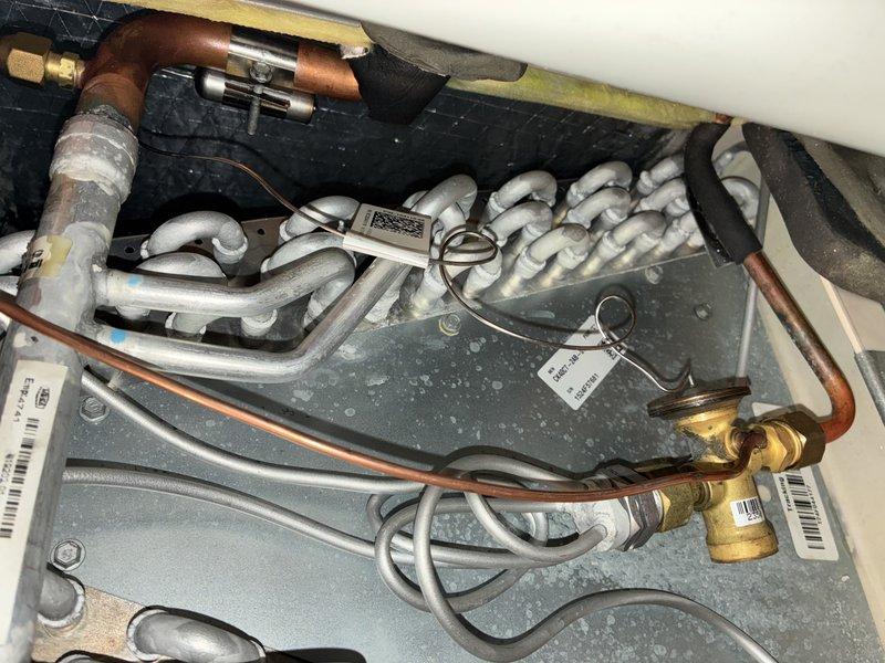 Performed annual preventive maintenance on one-year-old air conditioning system. Conducted comprehensive inspection of control board, electrical connections, evaporator coil assembly, and refrigerant lines. All components found to be operating within normal parameters with proper connections and no visible defects noted.