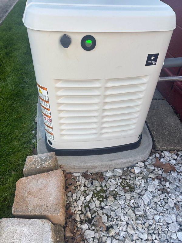 Performed scheduled preventive maintenance on residential Generac standby generator unit. Conducted comprehensive system diagnostics using digital testing equipment to verify battery voltage and overall electrical system health. Battery load test confirmed optimal performance with readings within manufacturer specifications. Inspected all exterior components including control panel, indicator lights, and ventilation louvers for proper operation. Verified unit status indicator showing normal standby mode. All systems tested and confirmed operational, ready for automatic transfer during utility power interruption.