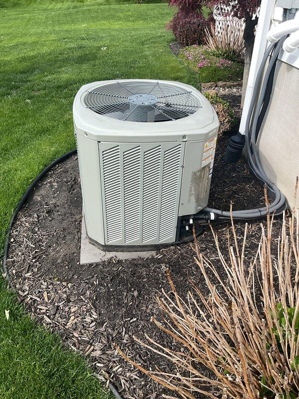 Completed MVP cooling maintenance visit on residential HVAC system over 12 years old. Performed comprehensive inspection of outdoor condenser unit and indoor Lennox furnace system, documenting equipment condition through photographs. Condenser unit showed normal weathering consistent with age and outdoor exposure but remains operational on concrete pad with proper drainage and clearance from landscaping. Verified all mechanical components, refrigerant lines, and electrical connections at both outdoor and indoor units, confirming system functionality for continued cooling season operation.