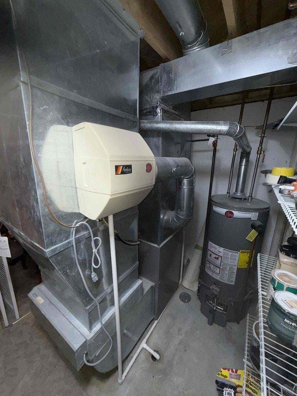 Completed comprehensive furnace maintenance inspection for residential heating system. Performed detailed examination of internal mechanical components, electrical connections, and wiring assemblies, including inspection of motor housing, copper refrigerant lines, and control circuits. Evaluated overall system operation, verified proper humidifier integration with furnace unit, and confirmed all components functioning within normal parameters.
