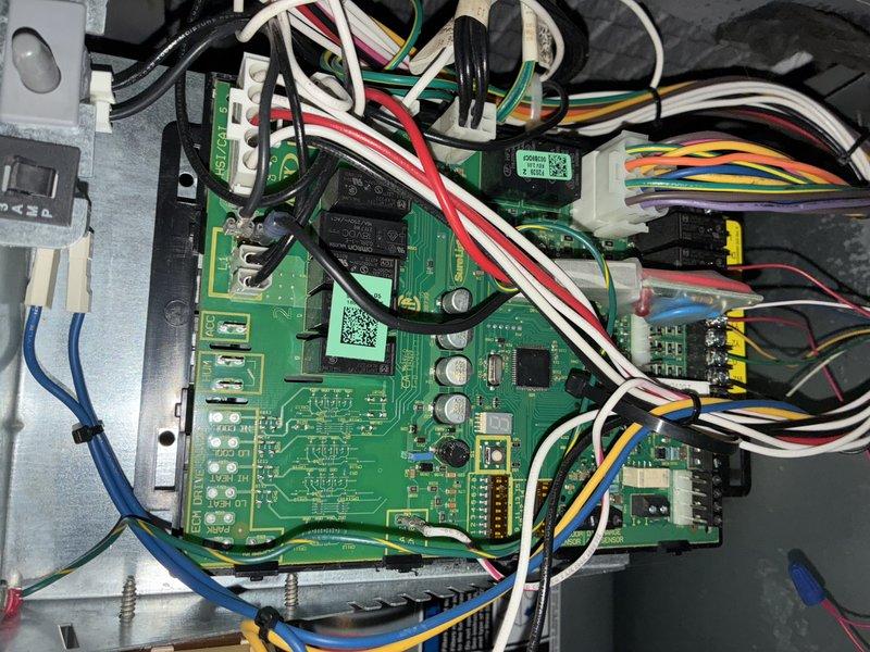 Completed MVP cooling maintenance visit on 7-year-old air conditioning system. Inspected air handler unit and found heavily soiled pleated air filter with significant dust and debris accumulation throughout accordion-style folds. Examined control board assembly, verifying proper operation of relays, integrated circuits, and electrical connections. All wire harnesses, connectors, and circuit board components found in good working condition with no signs of damage or failure.