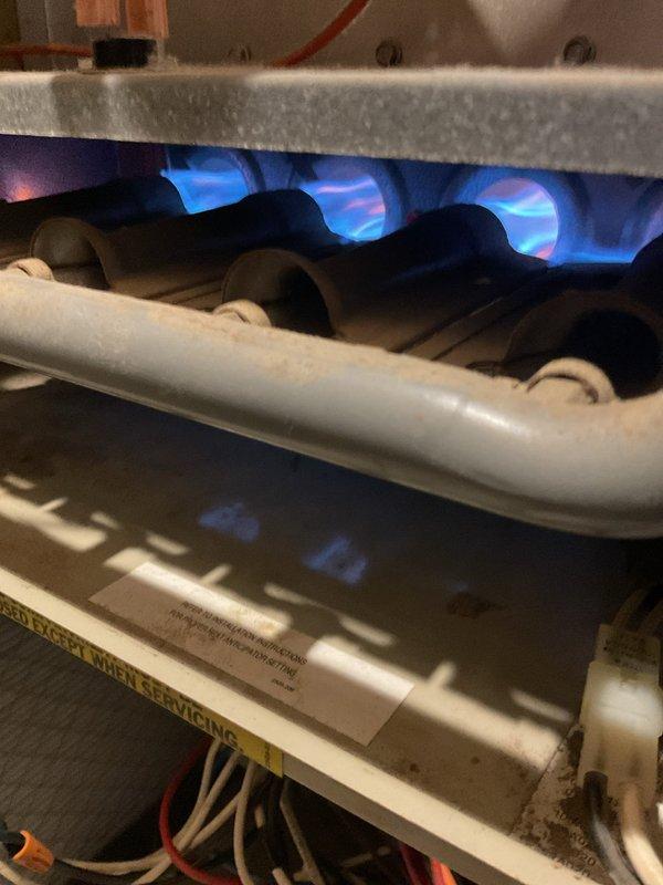 Responded to no heat call on 15-year-old furnace displaying high limit switch error code. Attempted repair by replacing faulty 195L-20F high limit switch with available 170L-20F unit. After replacement, system continued to display same error code and failed to produce heat. Performed electrical system reset at breaker panel, but issue persisted. Documented burner assembly operation and internal components. Unit requires further diagnostic work to identify underlying cause of repeated high limit tripping beyond switch replacement.