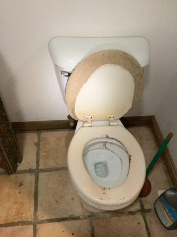 Responded to service call for garbage disposal flooding issue in laundry room when water was running. Upon inspection, determined the reported problem was actually related to bathroom plumbing rather than a garbage disposal unit. Examined sink drain assembly and toilet connections, documented existing plumbing configuration with P-trap, supply lines, and shut-off valves in proper working condition.