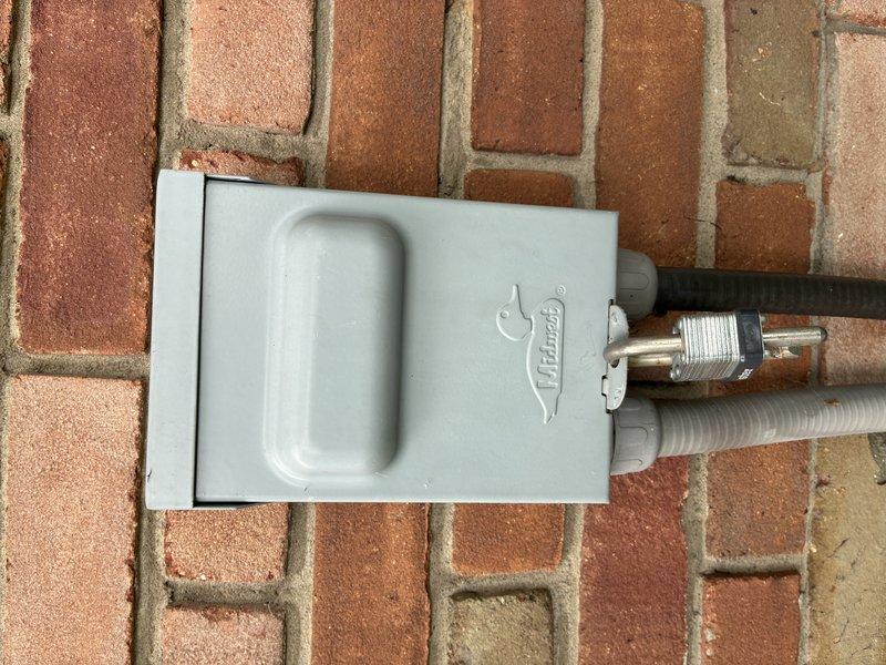 Completed MVP cooling maintenance visit on residential air conditioning system. Performed electrical diagnostics using clamp meter, recording amperage draw of 1.69 amps at the outdoor condensing unit. Inspected exterior disconnect box, conduit connections, and associated wiring to verify proper electrical connections and system operation.