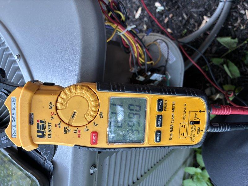 Completed MVP cooling maintenance visit on residential air conditioning system. Performed electrical diagnostics using clamp meter, recording amperage draw of 1.69 amps at the outdoor condensing unit. Inspected exterior disconnect box, conduit connections, and associated wiring to verify proper electrical connections and system operation.