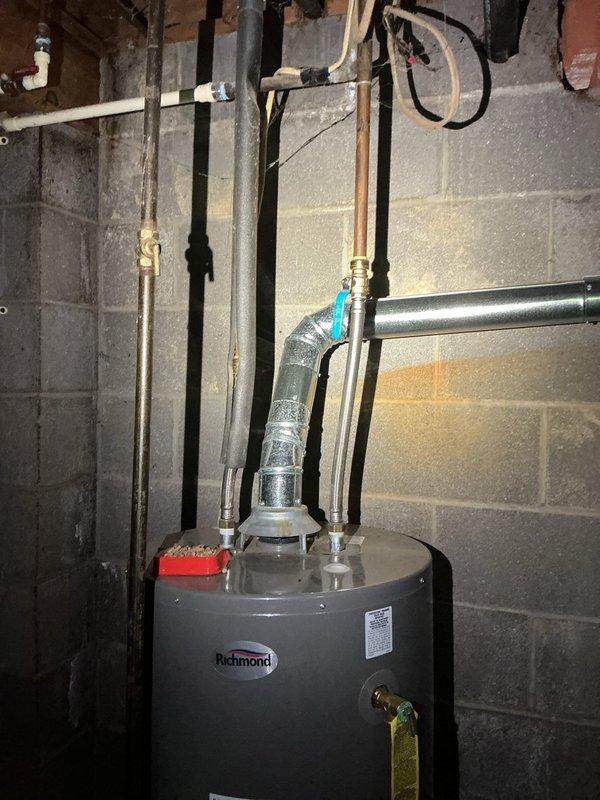 Completed outdoor spigot replacement and installed new water softener filter on existing 8-year-old Well-X-Trol system. Verified proper operation of dual-stage whole-house filtration system with pressure gauge reading within normal parameters, and confirmed water heater connections and plumbing infrastructure remained secure throughout the service work.