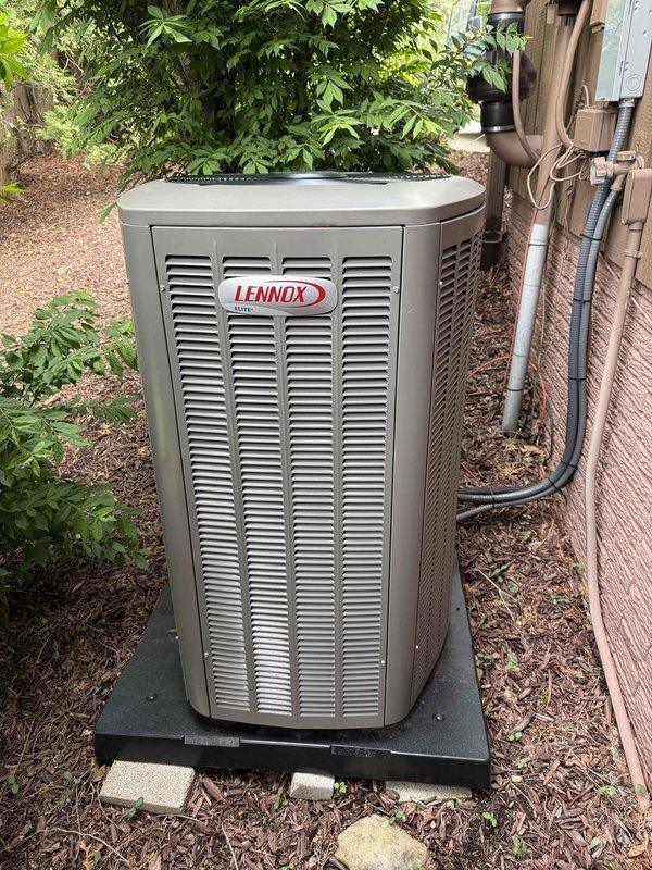 Completed annual preventative maintenance on a two-year-old Lennox air conditioning system for MVP member. Performed comprehensive inspection of outdoor condenser unit, verified proper operation of all components, cleaned condenser coils, checked refrigerant levels and electrical connections, and confirmed system is operating within manufacturer specifications. Unit showed excellent condition with no issues identified; all photos documented equipment status and proper installation.