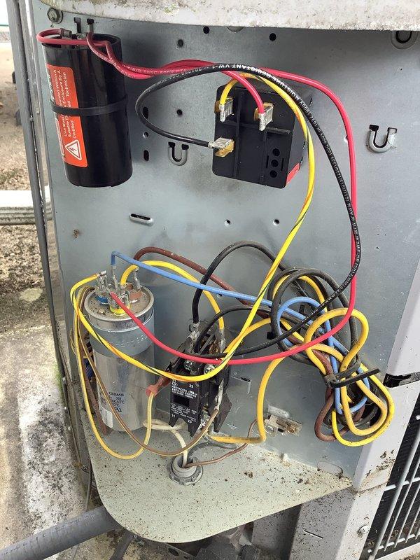 Completed MVP cooling maintenance visit on 5-year-old residential air conditioning system. Performed comprehensive inspection of outdoor condenser unit and electrical components, including visual examination of capacitors, contactors, and control relays within the electrical panel. Verified proper wiring connections throughout control circuit with color-coded power and control wiring intact. Inspected dual-capacitor configuration and associated electrical components for signs of wear or deterioration. Evaluated condenser unit positioning on concrete pad, confirmed adequate clearance from structure, and assessed overall system condition. All electrical connections secure, components functioning within normal parameters, and unit operating as designed for continued reliable cooling performance.