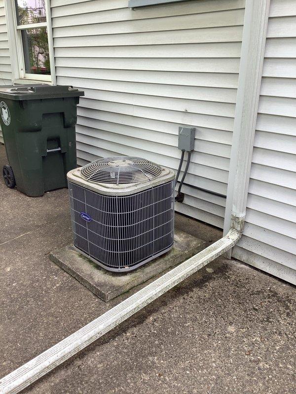 Completed MVP cooling maintenance visit on 5-year-old residential air conditioning system. Performed comprehensive inspection of outdoor condenser unit and electrical components, including visual examination of capacitors, contactors, and control relays within the electrical panel. Verified proper wiring connections throughout control circuit with color-coded power and control wiring intact. Inspected dual-capacitor configuration and associated electrical components for signs of wear or deterioration. Evaluated condenser unit positioning on concrete pad, confirmed adequate clearance from structure, and assessed overall system condition. All electrical connections secure, components functioning within normal parameters, and unit operating as designed for continued reliable cooling performance.