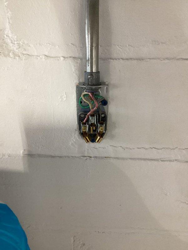 Responded to service call for 220V dryer outlet that shorted out during initial dryer installation at older single-family residence with updated electrical system. Investigated suspected ground wire issue between outlet and breaker panel in basement. Inspected electrical panel, circuit breakers, and associated wiring connections. Traced circuit from panel to dryer outlet location, verified proper wire routing and terminations. Tested voltage and continuity at outlet and panel to identify fault. Corrected improper ground wire connection and ensured proper circuit protection. Verified all connections secure at both outlet and breaker panel. Tested repaired circuit under load to confirm safe operation. System restored to proper working condition with no safety hazards present.