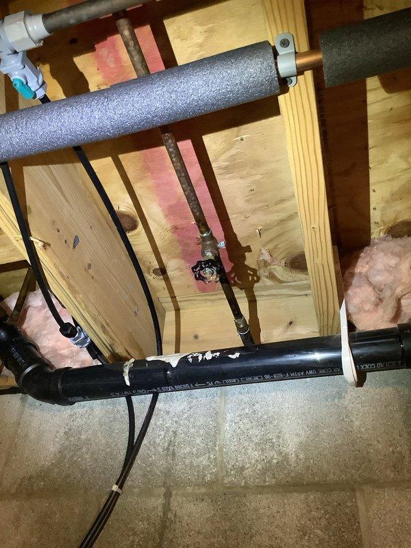 Responded to emergency call for outdoor spigot malfunction causing water spillage in basement. Upon arrival, found warning notice posted on exterior wall advising against faucet use. Performed diagnostic inspection of outdoor hose bib and traced supply line through crawl space, identifying failed or disconnected pipe connection between outdoor spigot and main water supply line. Water was bypassing the spigot fixture entirely and discharging into basement area when valve was opened. Advised customer to keep outdoor faucet in off position until repair work can be completed to reconnect or replace damaged supply piping and restore proper water flow to exterior fixture.