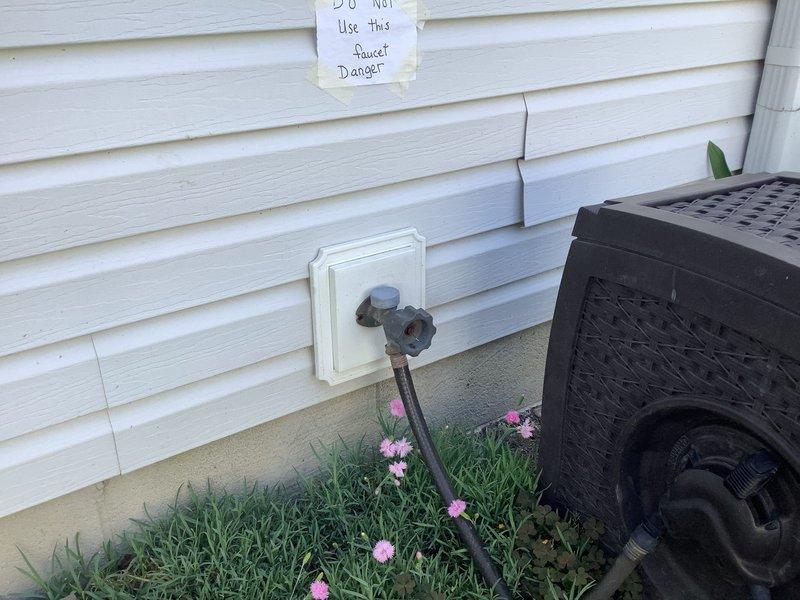 Responded to emergency call for outdoor spigot malfunction causing water spillage in basement. Upon arrival, found warning notice posted on exterior wall advising against faucet use. Performed diagnostic inspection of outdoor hose bib and traced supply line through crawl space, identifying failed or disconnected pipe connection between outdoor spigot and main water supply line. Water was bypassing the spigot fixture entirely and discharging into basement area when valve was opened. Advised customer to keep outdoor faucet in off position until repair work can be completed to reconnect or replace damaged supply piping and restore proper water flow to exterior fixture.