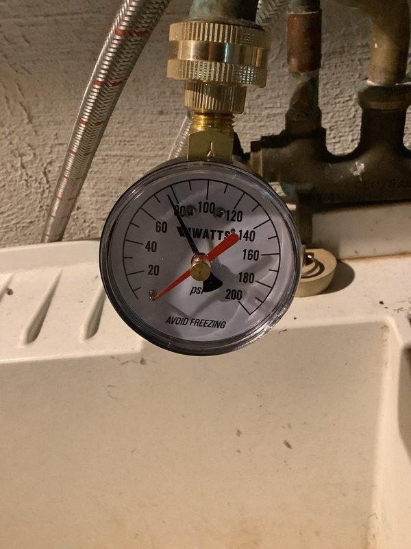 Performed no-cost estimate for replacement of 19-year-old gas water heater exhibiting active leak from tank bottom. Upon inspection, confirmed water damage on concrete floor surrounding unit base and verified installation date of July 2007 from tank markings. Assessed existing plumbing connections, pressure relief valve, gas supply line, and venting system to determine replacement requirements and specifications for new water heater installation.