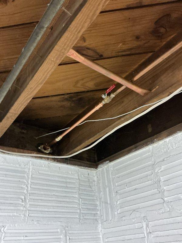 Repaired two dripping exterior hose bibs and replaced a faulty shut-off valve located at the back corner of the residence. The shut-off valve replacement was performed in the attic/ceiling space where the copper supply line was accessed, requiring work among the wooden framing and insulation. All exterior faucets were tested for proper operation and leaks were eliminated upon completion.