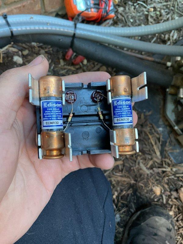 Completed annual cooling maintenance and tune-up on residential air conditioning system. Inspected outdoor condensing unit, verified proper operation of all components, checked electrical connections and fuses in disconnect block, and confirmed system is functioning correctly. Unit showed normal wear consistent with regular use, with all refrigerant lines and electrical conduit properly secured.