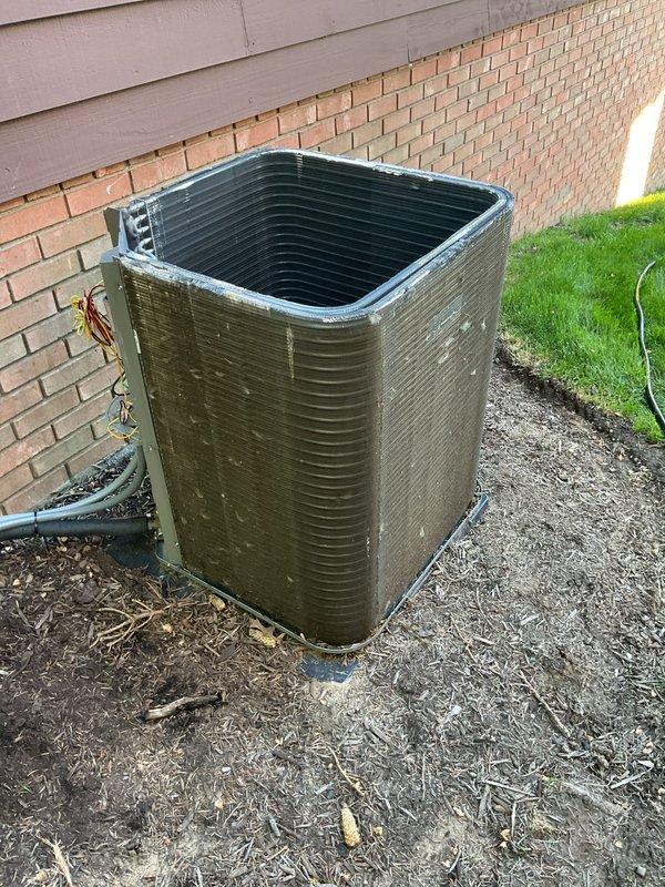 Completed annual cooling maintenance and tune-up on residential air conditioning system. Inspected outdoor condensing unit, verified proper operation of all components, checked electrical connections and fuses in disconnect block, and confirmed system is functioning correctly. Unit showed normal wear consistent with regular use, with all refrigerant lines and electrical conduit properly secured.