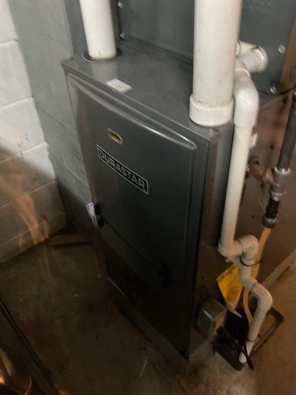 Completed annual maintenance on 22-year-old DUOSTAR furnace system located in basement of duplex residence. Performed comprehensive tune-up including inspection of heat exchanger, burner assembly, ignition system, and all safety controls. Verified proper operation of venting system and condensate drainage lines, checked all electrical connections, and tested system startup and shutdown cycles to ensure safe and efficient operation.