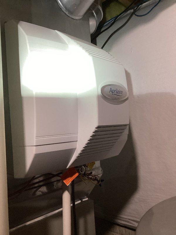 Completed MVP Cooling Visit recurring maintenance service on residential HVAC system. Performed comprehensive inspection of teal air handler unit, furnace, and associated Aprilaire whole-home humidifier. Verified proper operation of all equipment, inspected PVC condensate drain lines for blockages, checked electrical connections, and documented system condition through photographic records to ensure optimal cooling performance for the upcoming season.
